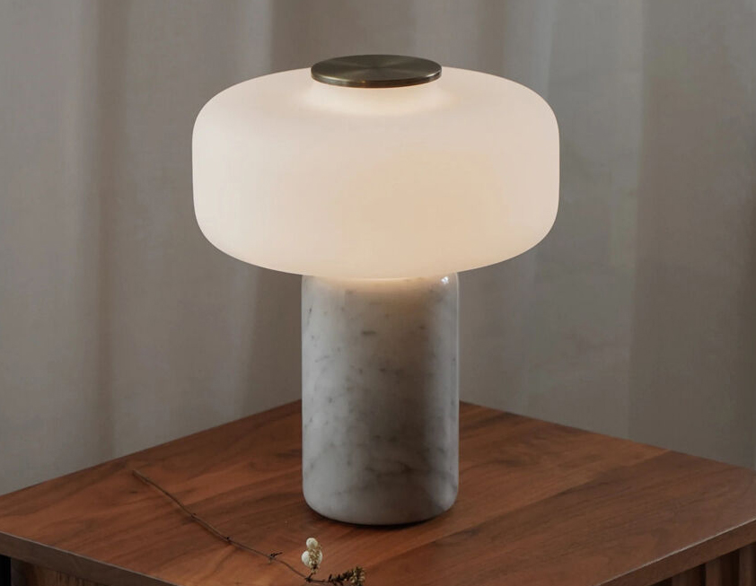 Fonte Table Lamp - Unique Composition of Marble Base and a Frosted Glass Shade 3 Fonte table lamp with marble base and frosted glass shade emitting warm ambient light on a wooden side table
